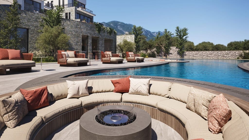 Resort-style apartment pool deck and lounge area at an Alsancak development near Kyrenia